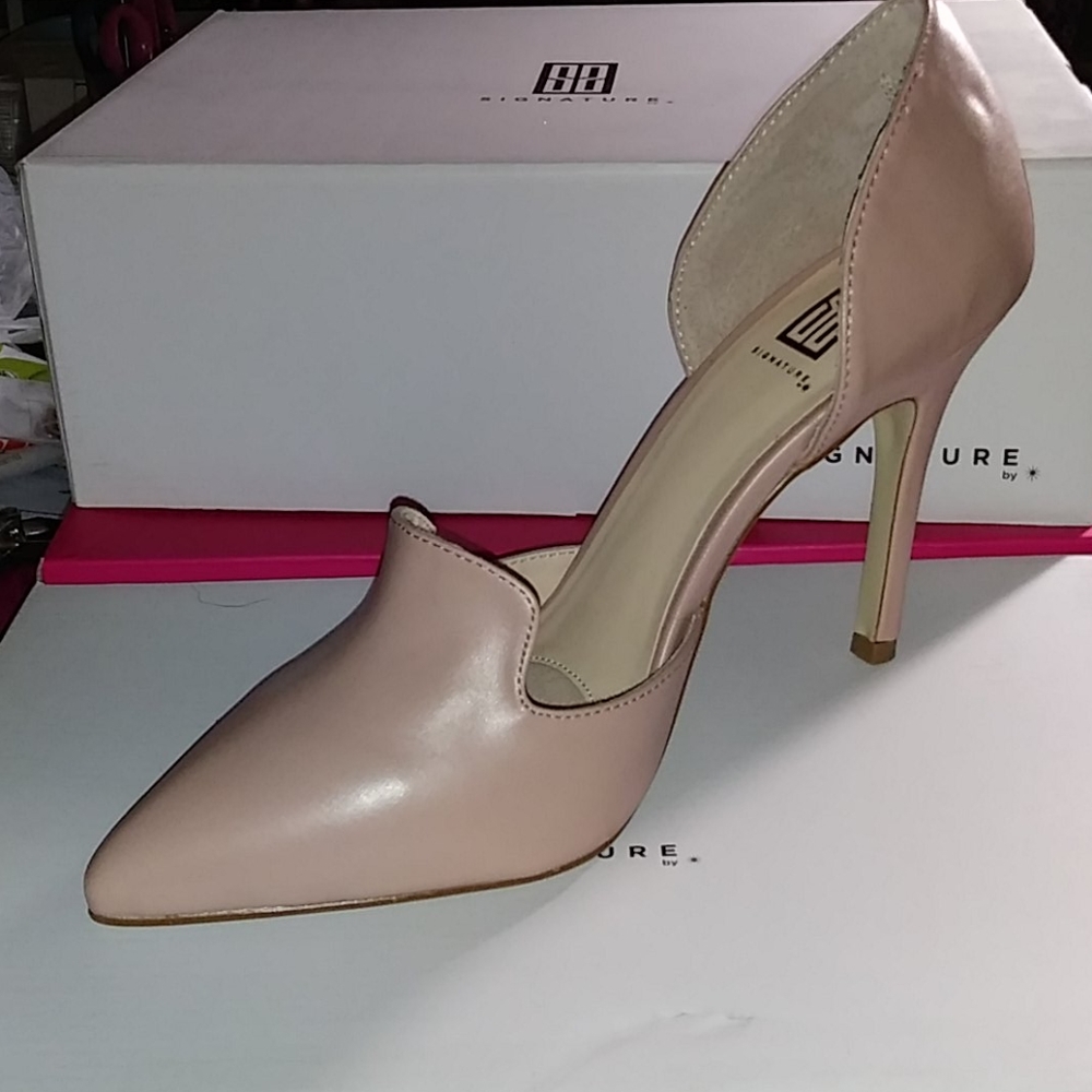Never worn! Signature Pumps